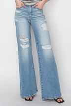 Risen High-Rise Wide Distressed Western Jeans — Light Wash Playful Distressing with Wide-Leg Cut
