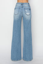 Risen High-Rise Wide Distressed Western Jeans — Light Wash Playful Distressing with Wide-Leg Cut